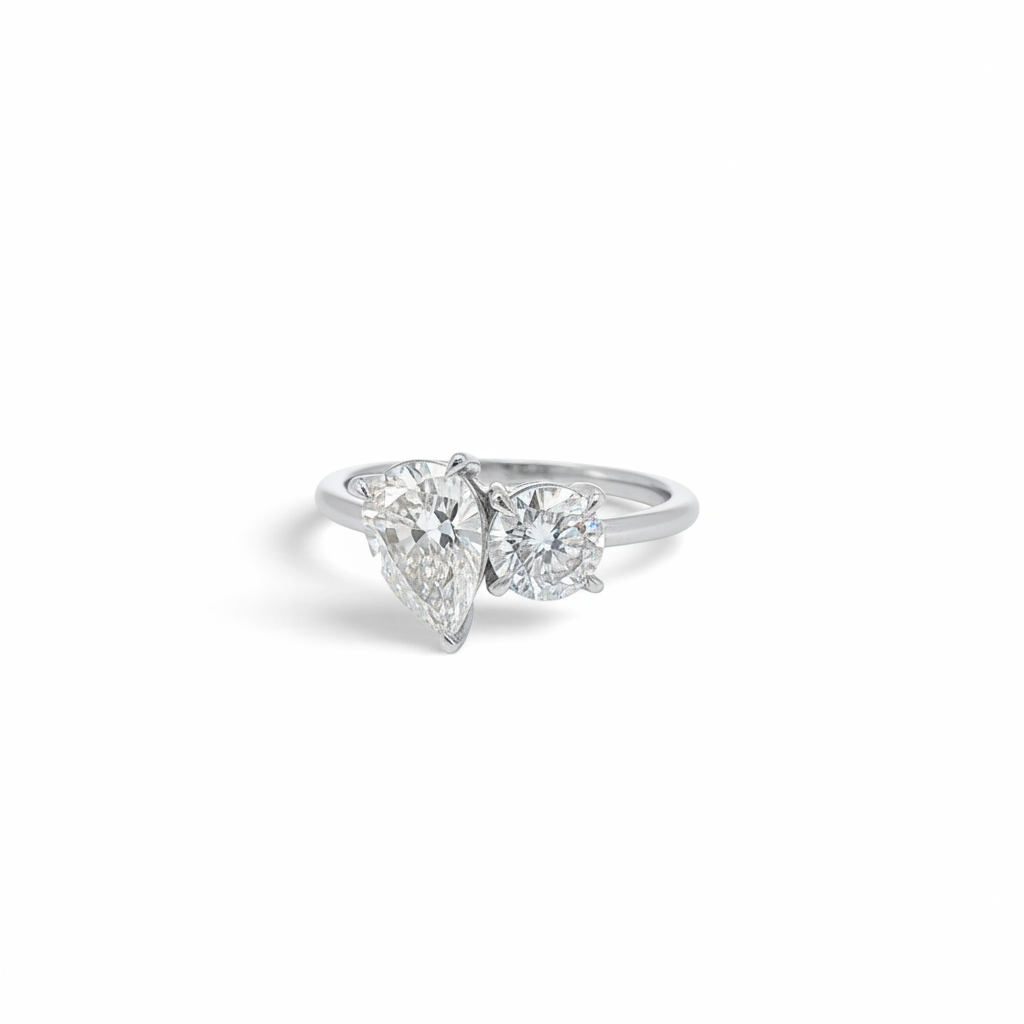 Bijoux Village Fine Jewellers 14K white gold Toi et Moi ring with a pear-shaped and round brilliant natural diamond.