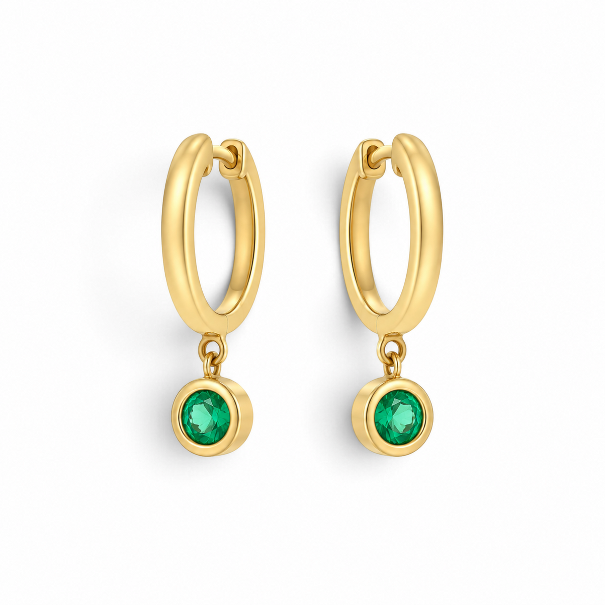 Bijoux Village Fine Jewellers 18K yellow gold huggie hoop earrings with round bezel-set emerald drops