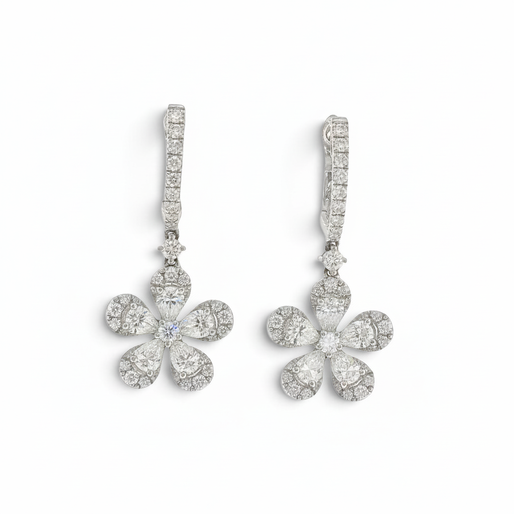 Bijoux Village Fine Jewellers 18K white gold floral drop huggie earrings with pear and round brilliant natural diamonds.