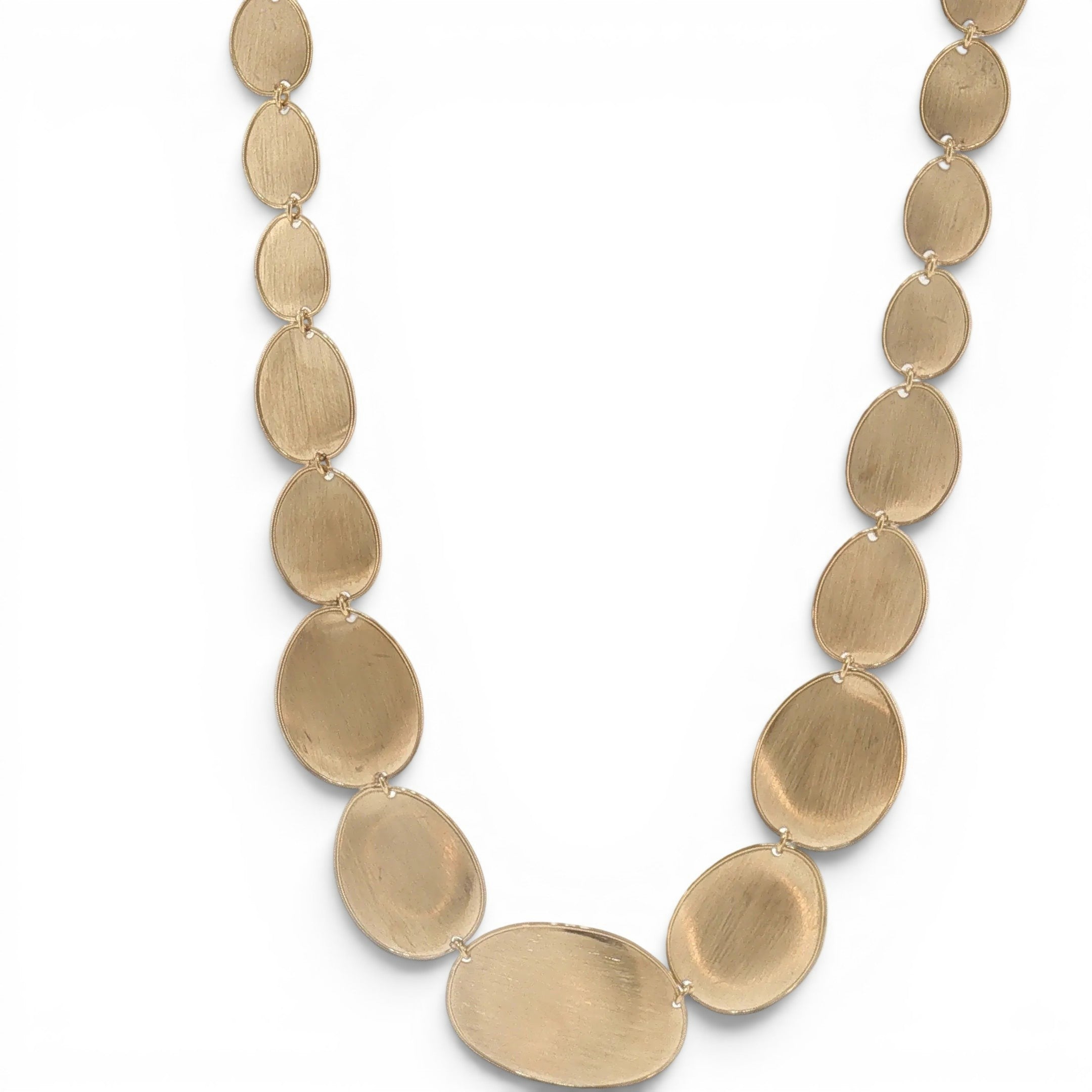 A gold-toned disc-link necklace with oval links, displayed on a clean white background.