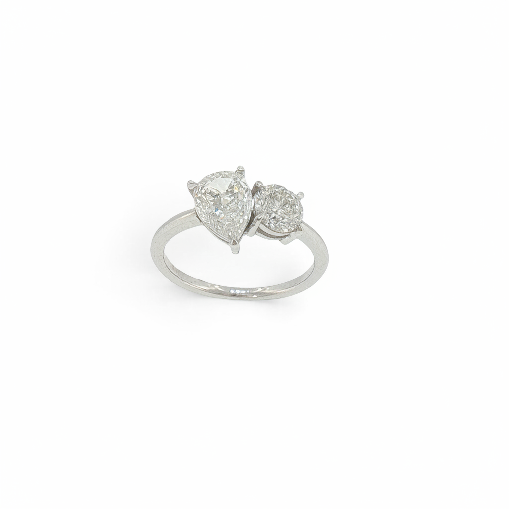 Bijoux Village Fine Jewellers 14K white gold Toi et Moi ring featuring a pear and round natural diamond claw set.