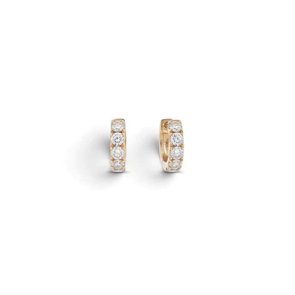 Bijoux Village Fine Jewellers 18K yellow gold huggie hoop earrings featuring a row of round brilliant natural diamonds.