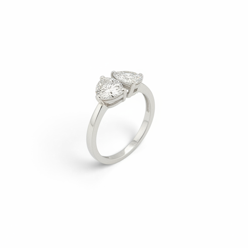 Bijoux Village Fine Jewellers 14K white gold Toi et Moi ring with a pear-shaped and round brilliant natural diamond.