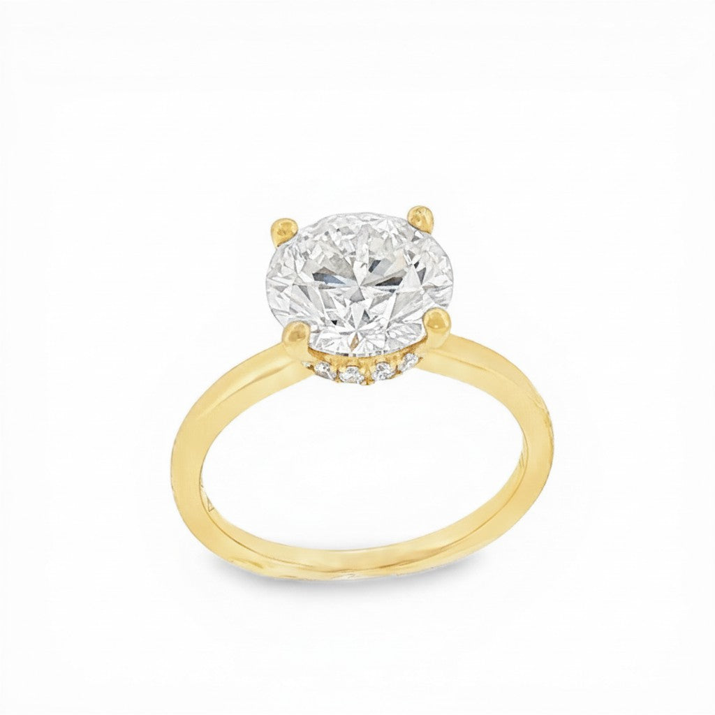 Bijoux Village Fine Jewellers 18K yellow gold ring with a 3.08 CT round brilliant diamond and hidden halo.