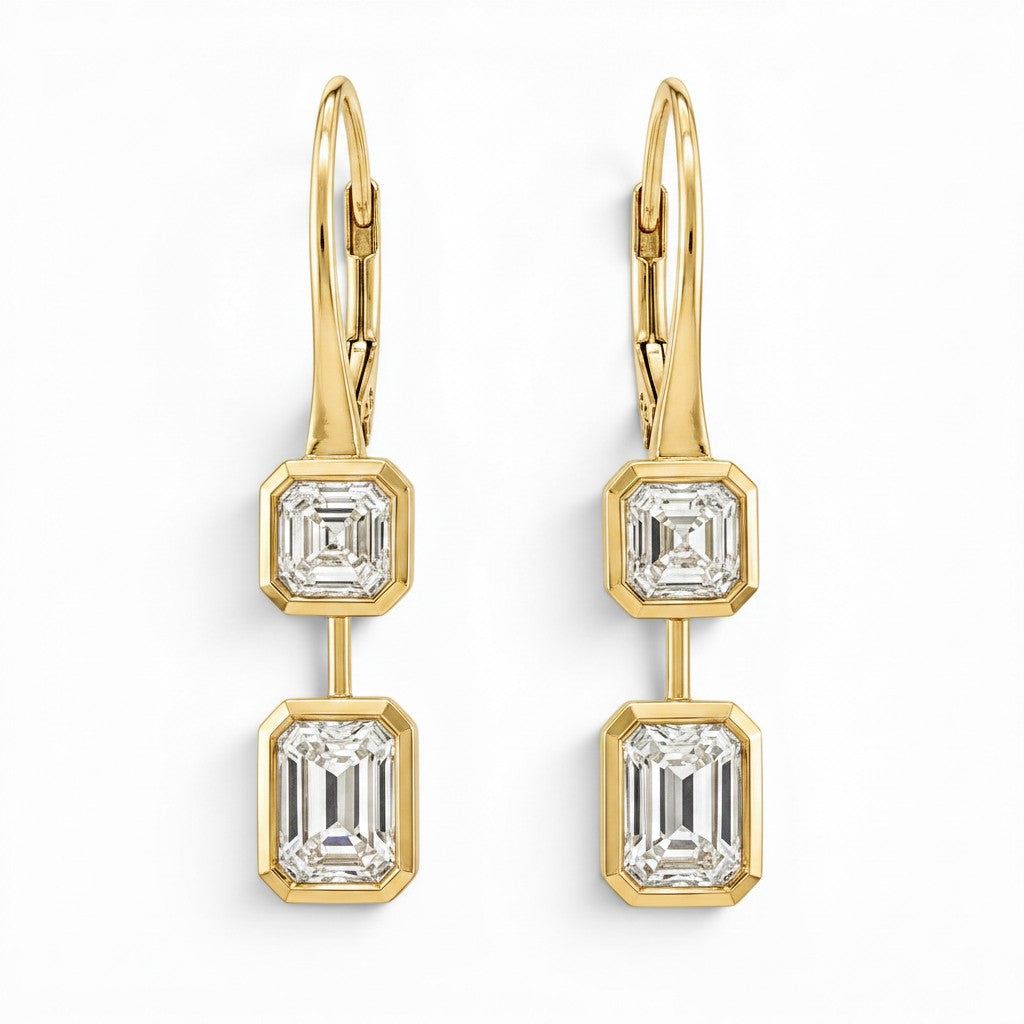 Bijoux Village Fine Jewellers 18K yellow gold drop earrings featuring bezel-set asscher and emerald-cut diamonds.