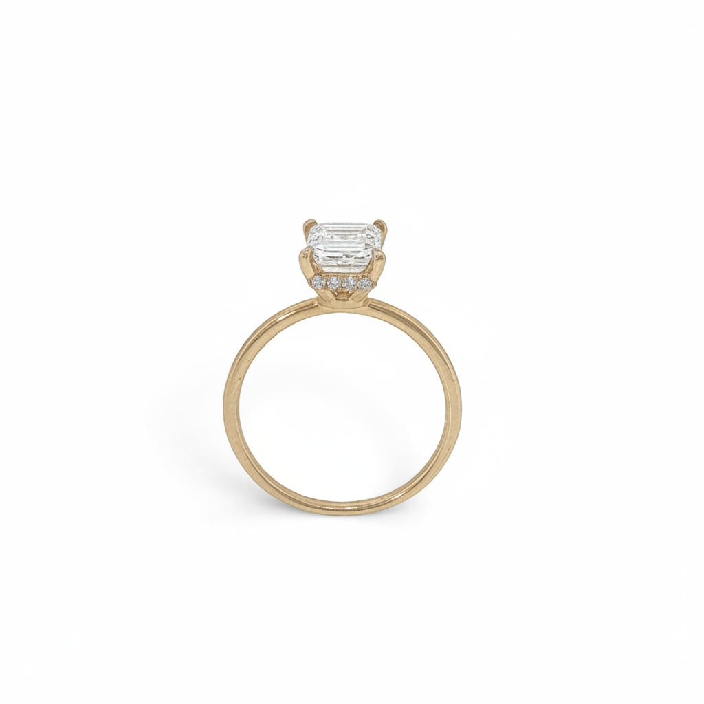 Bijoux Village Fine Jewellers 18K yellow gold ring with a 1.51 CT emerald-cut lab-grown diamond and hidden halo.