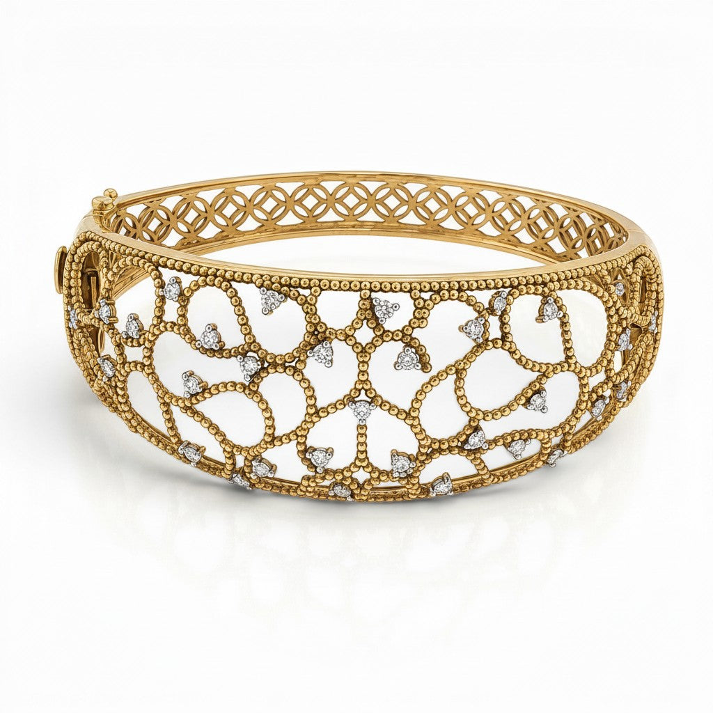 Bijoux Village Fine Jewellers 14K yellow gold Italian hinged bangle with intricate openwork and 1.09 CT natural diamonds.