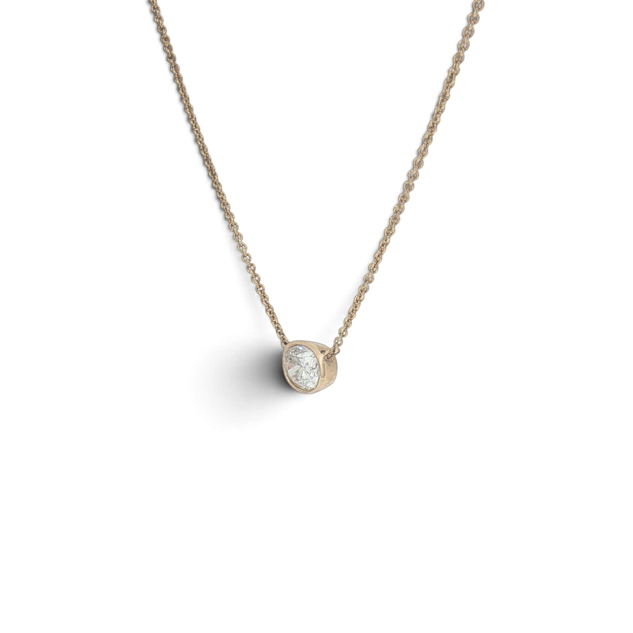 Bijoux Village Fine Jewellers 14K yellow gold necklace with a 0.48 CT oval diamond in a horizontal bezel setting.